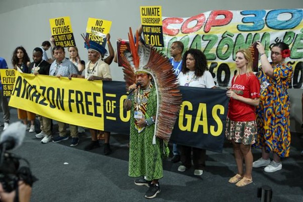 Photo of indigenous Amazonians protesting in the corridors of COP30