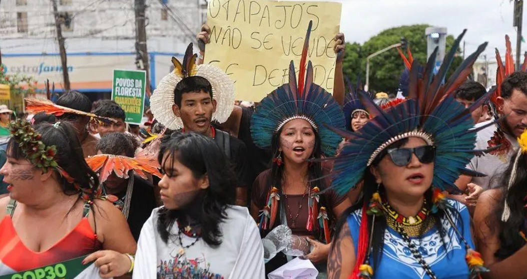 Indigenous people protesting in Belem