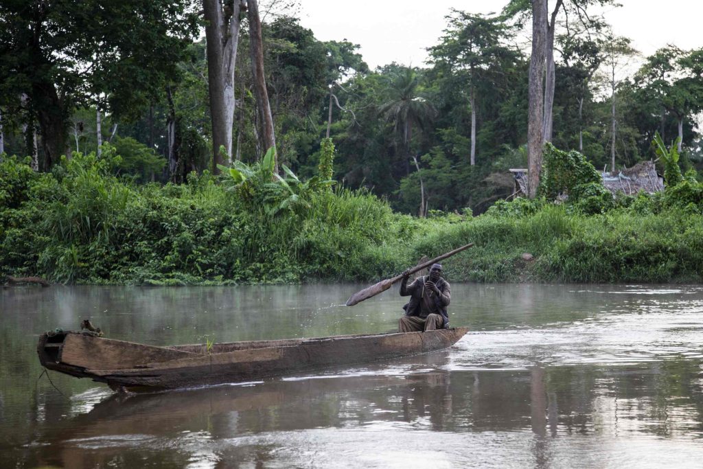 Kuete David on his pirogue on the river Mbam. Dominique Catton. Credit: SightsaversG