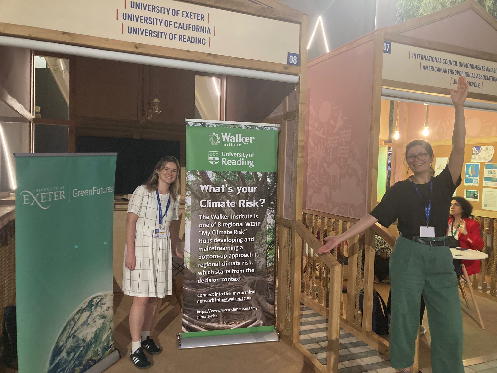 Pip Oppenheimer and Fiona Spuler in front of the exhibit space University of Reading held at COP28