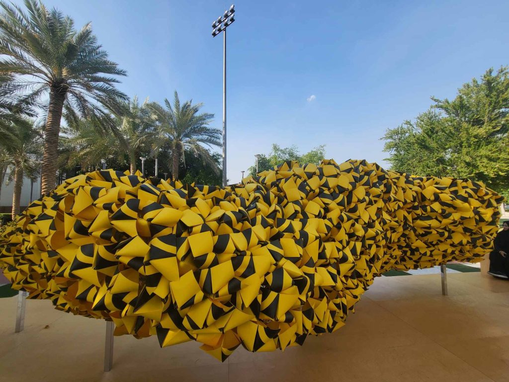 swarm of origami bees at COP28 Terra pavilion in the Green zone