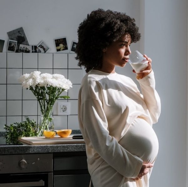 pregnant woman drinking water