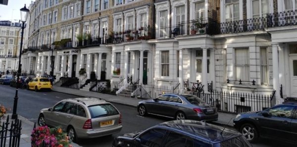Row of houses in a busy city street.