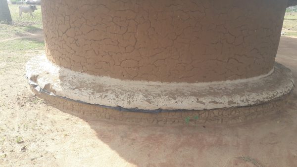Waterproofed hut foundations reducing flood risk in Katakwi, Uganda, an example of the kind of climate adaptation investment insurance and finance need to support.
